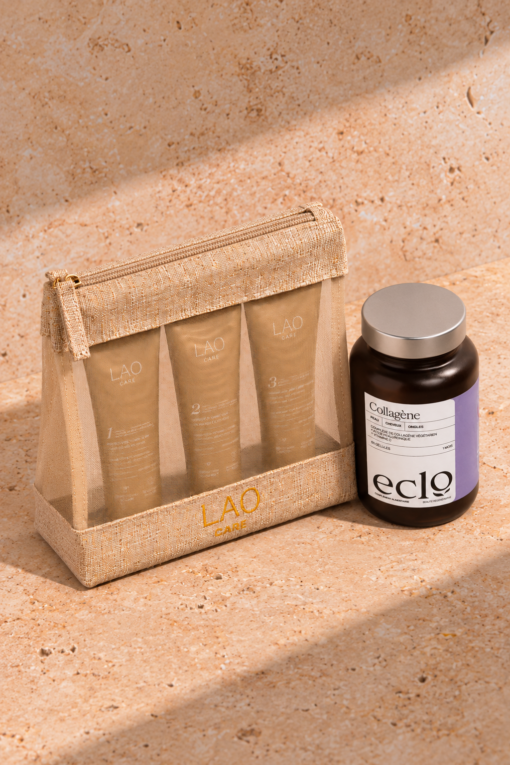 Pack LAO Care x Eclo : trousse voyage et pot de collagène sur travertin